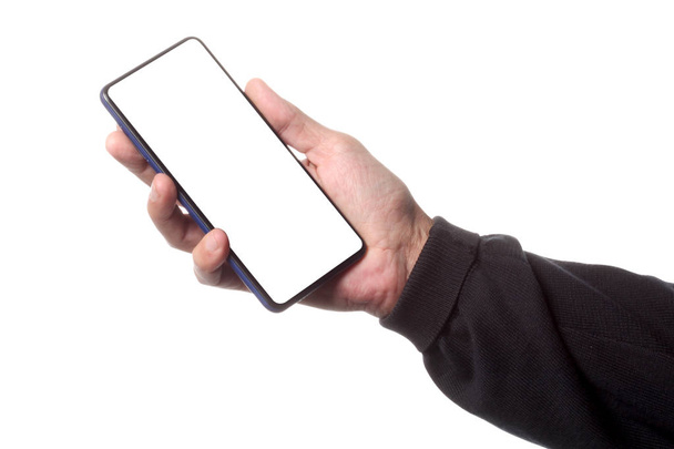 uomo maschio in possesso e mostrando smart phone vuoto isolato su sfondo bianco con percorso di ritaglio intorno a mano e visualizzare con spazio di copia per il testo
 - Foto, immagini