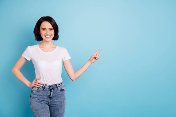 Portrait of her she nice attractive lovely cheerful cheery confident glad girl pointing forefinger aside ad advert copy space isolated on bright vivid shine vibrant blue turquoise color background - Foto, Imagem