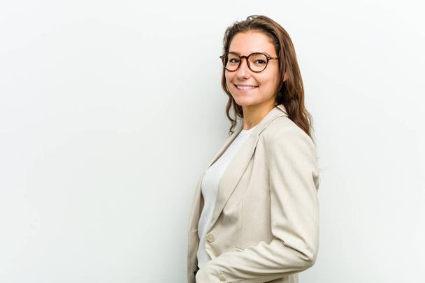 Young european business woman looks aside smiling, cheerful and pleasant. - Foto, Bild