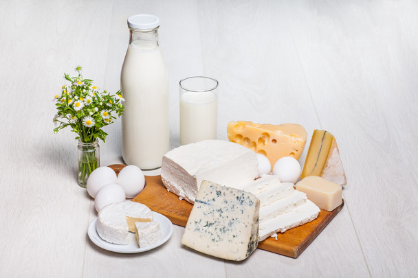 Milk and food on wooden background - Photo, Image