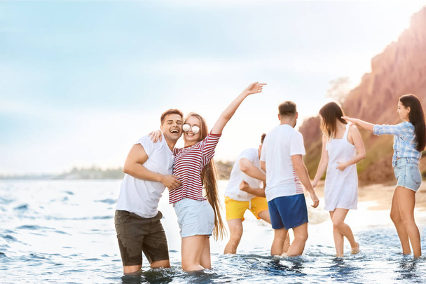 Happy friends on sea beach at resort - Φωτογραφία, εικόνα