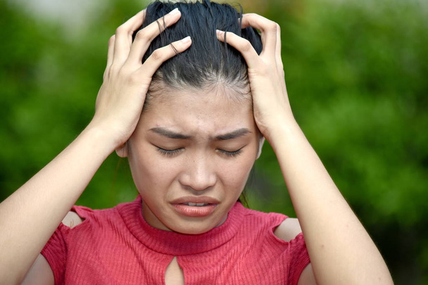 A Stressed Young Asian Person - Foto, afbeelding