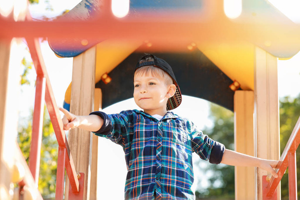 Cute little boy on play ground - Photo, Image