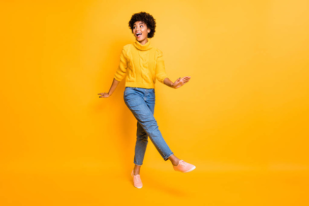 Full length body size photo of curly charming cute cheerful nice girlfriend wearing jeans denim jumper footwear going somewhere isolated bright color background - Φωτογραφία, εικόνα