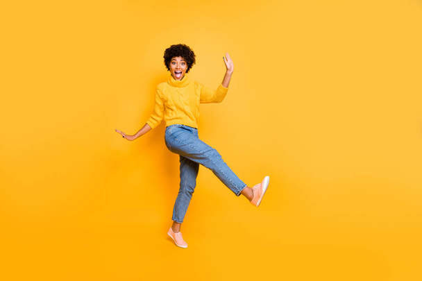 Full length body size view of her she nice attractive cheerful cheery playful comic wavy-haired girl having fun free time fooling isolated on bright vivid shine vibrant yellow color background - Photo, Image