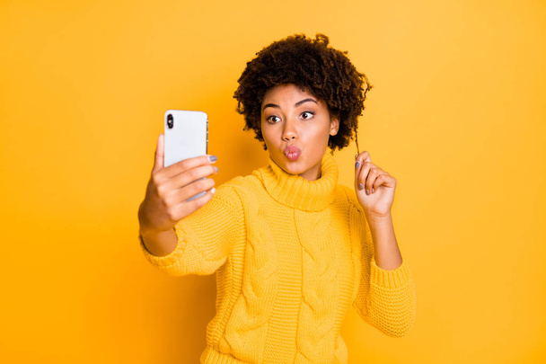 Portrait of her she nice attractive charming lovely flirty feminine wavy-haired girl taking selfie sending kiss pout lips isolated over bright vivid shine vibrant yellow color background - Photo, Image