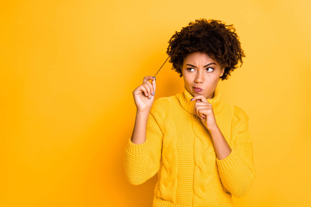 Copyspace photo of pensive thoughtful girlfriend thinking about what to do with her hair wearing yellow jumper while isolated over vivid color background - Photo, Image