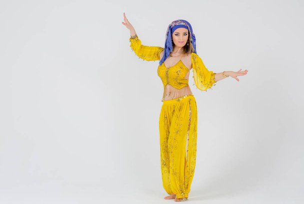 Beautiful woman arabian turkish oriental in carnival yellow costume - Fotoğraf, Görsel