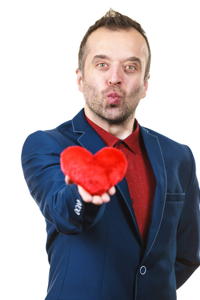 Man in suit holding heart - Zdjęcie, obraz
