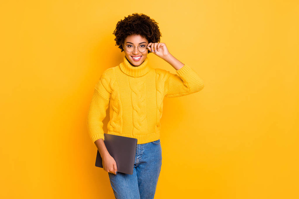 Photo of cheerful cute charming nice fascinating girlfriend wearing yellow jumper jeans denim spectacles being intelligent isolated over vibrant color background - Foto, imagen