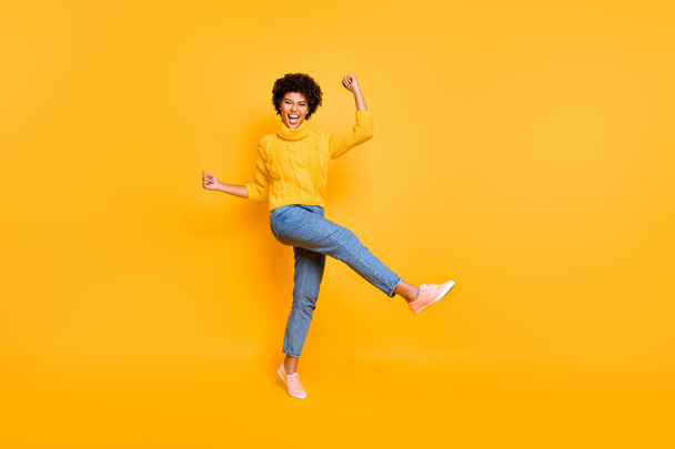 Full length body size view of her she nice attractive charming cheerful cheery ecstatic wavy-haired girl celebrating luck having fun isolated on bright vivid shine vibrant yellow color background - Foto, Imagen