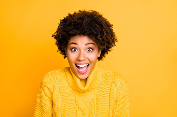 Photo of dark skin beautiful lady overjoyed by low shopping prices wear warm knitted pullover isolated yellow color background - 写真・画像