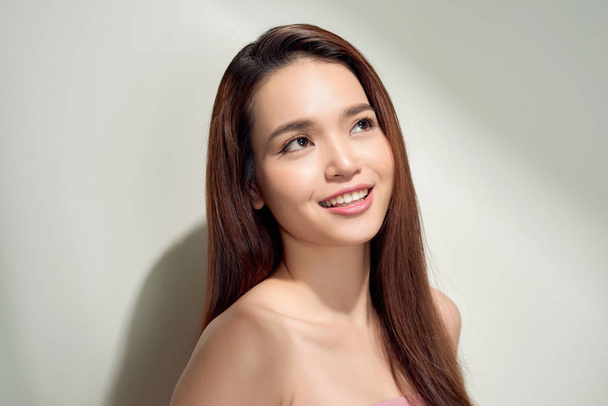 Beauty asian girl with long and shiny hair . Beautiful model woman with long hairstyle. Care and beauty - Photo, Image