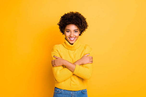 Photo of dark skin lady holding hands on shoulders want some hugs wear warm knitted sweater isolated yellow color background - 写真・画像