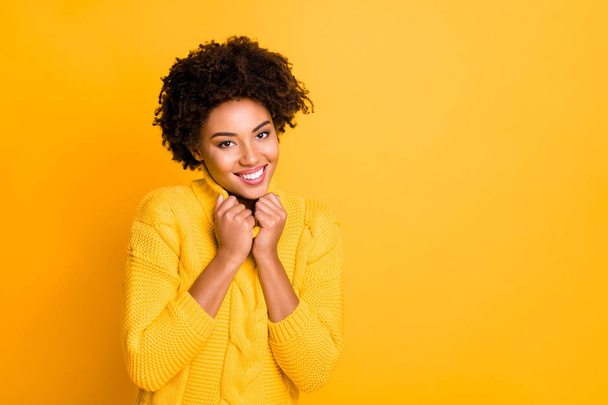 Closeup photo of amazing dark skin lady with sweet beaming smile wear warm knitted pullover isolated yellow color background - Φωτογραφία, εικόνα