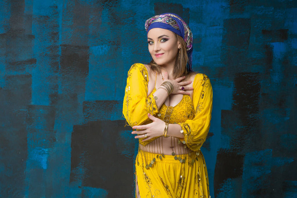 Beautiful woman arabian turkish oriental in carnival yellow costume - Φωτογραφία, εικόνα