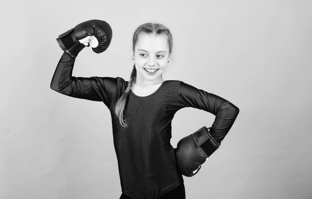Happy child sportsman in boxing gloves. Sport success. sportswear fashion. Fitness diet. energy health. workout of small girl boxer. punching knockout. Childhood activity. Happy and sporty - Foto, Imagem