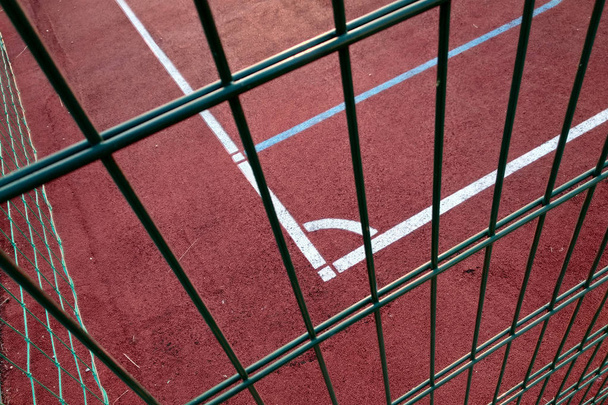 Close-up of white marking lines of outdoor basketball court fenc - Photo, Image