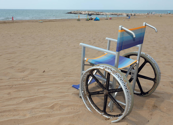 wheelchair made with alloy of aluminium to move on the sand of b - Photo, Image