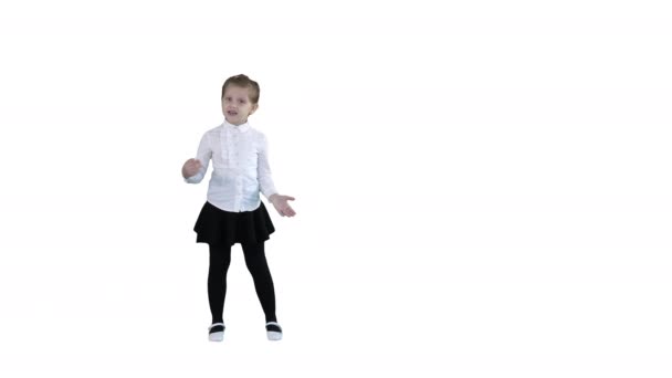 Girl singing a song in a cute way on white background. - Footage, Video