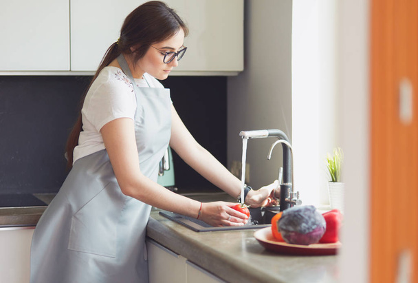 Hands of woman washing vegetables at her kitchen - Fotografie, Obrázek