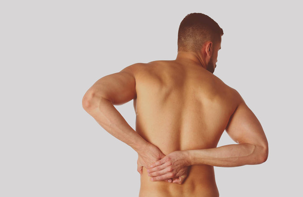 Young man holding his neck in pain. Medical concept - Foto, Bild