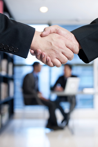 Close up of businessmen shaking hands - Photo, Image
