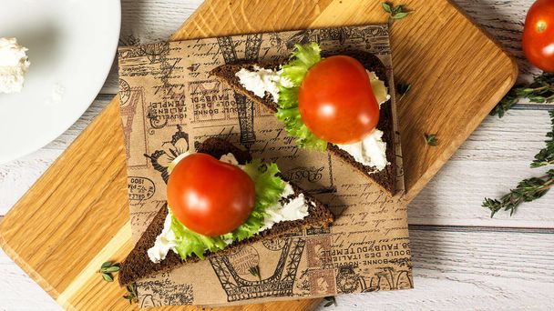 Healthy Snacks Sandwiches with goat cheese, salad, cherry tomatoes. Instagram style top view - Фото, изображение