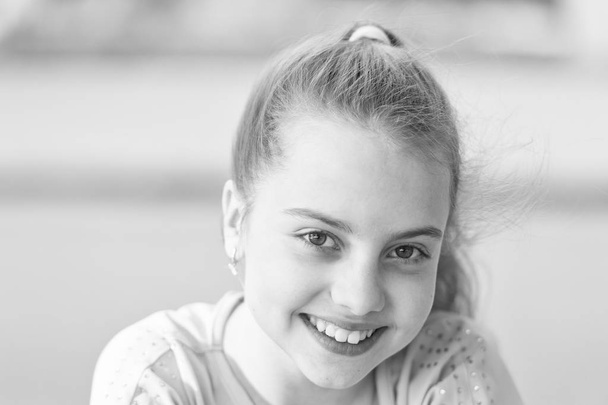 Enjoying the beauty of a healthy smile. Cute small child with long blond hair and happy smile. Smiling kid with white healthy smile on beautiful face. Adorable little girl with big smile - Fotoğraf, Görsel