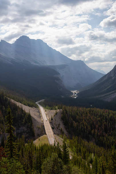 Aerial view of a scenic road in the Canadian Rockies during Sunny Summer Day. Taken in Icefields Pkwy, Jasper, Alberta, Canada. - Zdjęcie, obraz