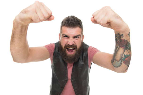 His tattoo is perfect. Angry man showing his arms with tattoo. Brutal hipster with tattoo shouting and shaking fists. Bearded man with permanent ink tattoo covering skin - Fotografie, Obrázek