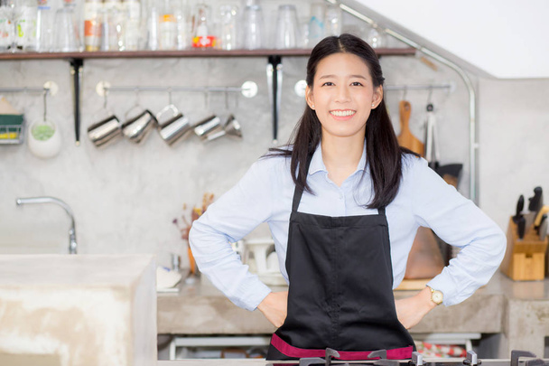 Portrait of beautiful young barista, asian woman is a employee s - 写真・画像