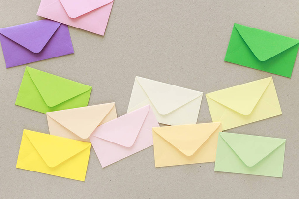 Colorful envelopes on grey paper background, copy space. - Foto, Imagen
