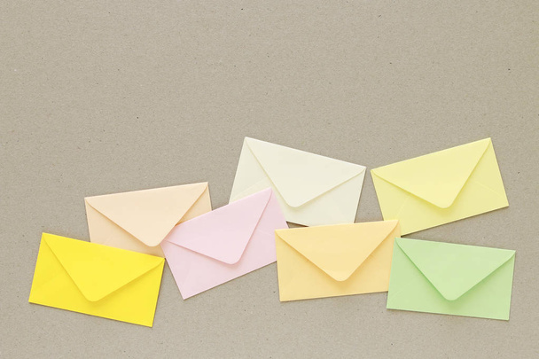 Colorful envelopes on grey paper background, copy space. - Foto, afbeelding