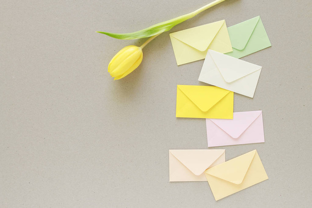 Colorful envelopes on grey paper background, copy space. - Foto, imagen