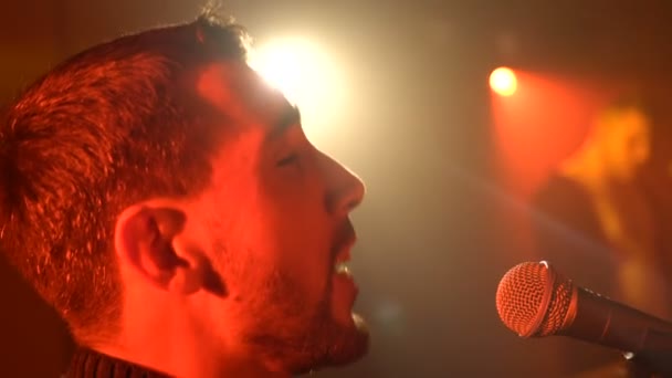 Musician sings into a microphone - Footage, Video