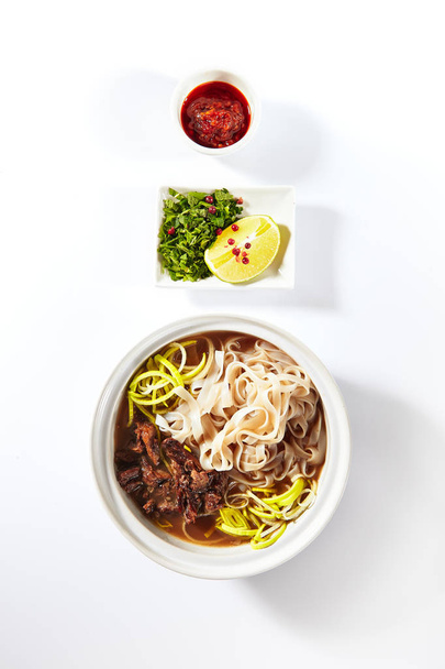 Traditional Vietnamese Soup Pho Bo with Beef Meat Isolated - Foto, Imagen