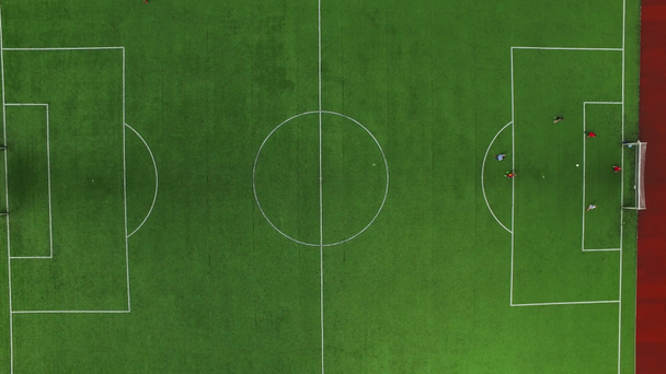 Football marker on field. Drone view soccer players training on football field - Footage, Video
