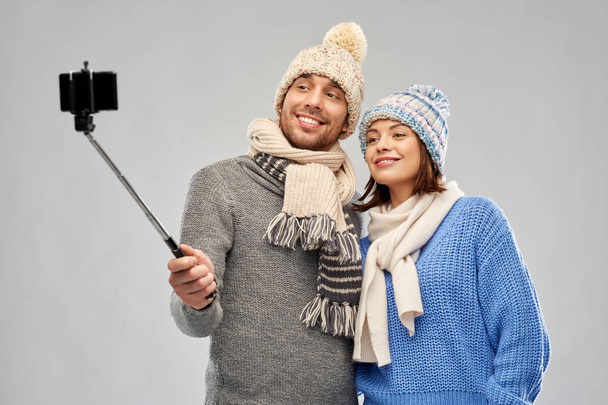 happy couple in winter clothes taking selfie - Fotoğraf, Görsel