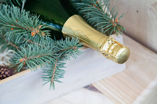 Christmas decor and a bottle of champagne  - Φωτογραφία, εικόνα