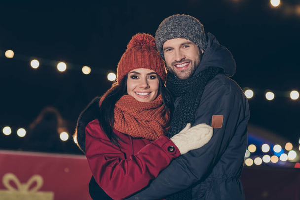 Portrait of his he her she nice attractive charming lovely cheerful cheery tender engaged couple wearing warm outfit embracing spending honeymoon vacation outdoors - Фото, изображение