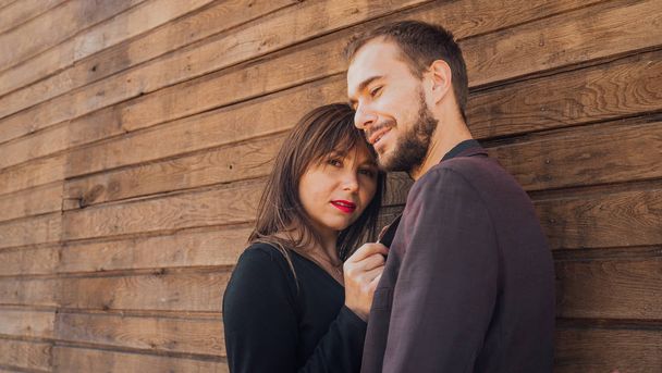 This is love. girl with guy posing on a wooden background. happy valentines day. summer vibes. couple relax outdoor. Couple relaxing enjoying each other. Hipster and pretty woman in love. Fall in love - Φωτογραφία, εικόνα