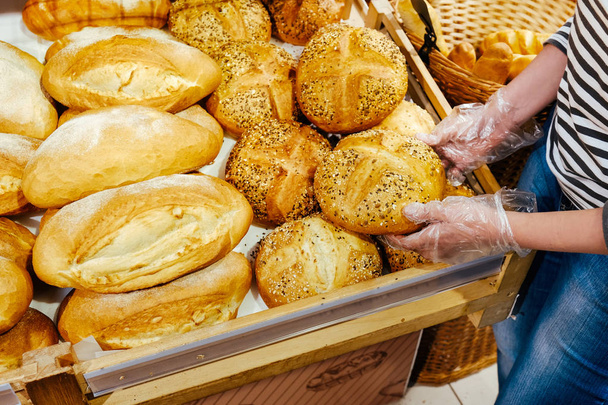 bread femle hand food background brown graine baguette roll pastries batch product baked - Fotó, kép