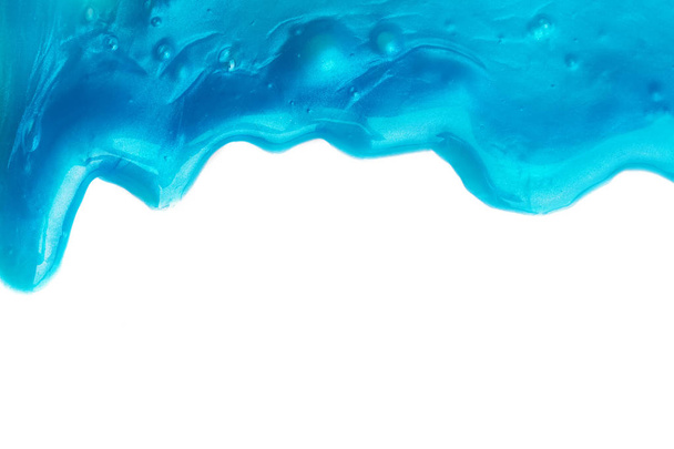 Abstact drips of blue paint or slime isolated on white - Foto, afbeelding