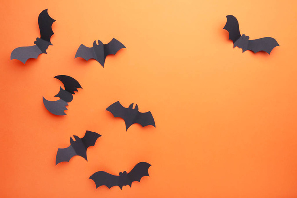 Halloween paper bats on orange background. Halloween concept - Foto, Imagen