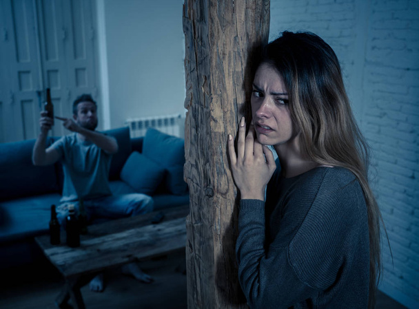Social issues Domestic violence concept. Young couple having arguments and problems with alcoholic husband. Man threatening scared wife or girlfriend terrified of aggression and domestic abuse. - Φωτογραφία, εικόνα