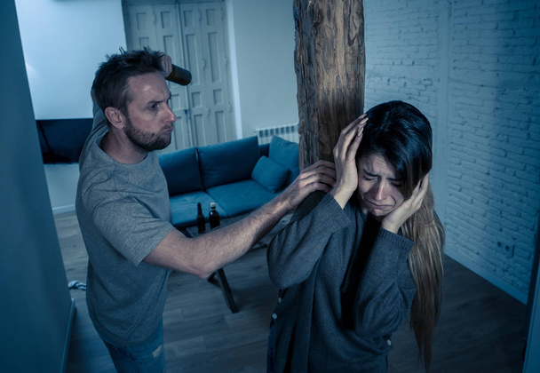 Social issues Domestic violence concept. Alcoholic and abuser partner beating and threatening his terrified wife. Violent man physically abusing scared girlfriend terrified of aggression and abuse. - Φωτογραφία, εικόνα