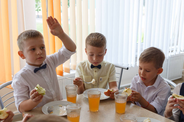 Children eat a treat at their first Breakfast - Фото, зображення