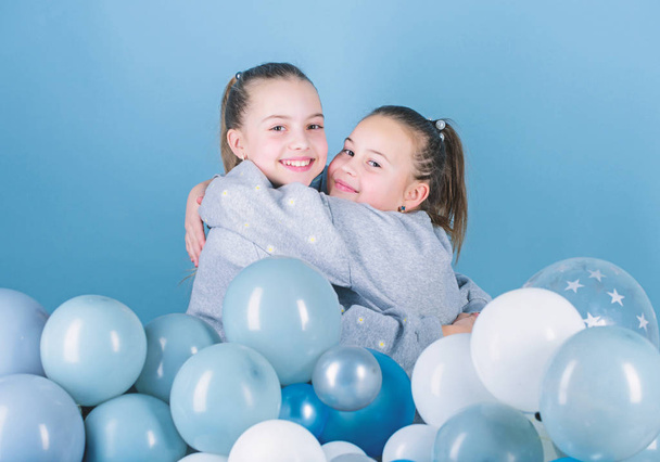 Girls best friends near air balloons. Birthday party. Happiness and cheerful moments. Carefree childhood. Start this party. Sisters organize home party. Having fun concept. Balloon theme party - Фото, зображення