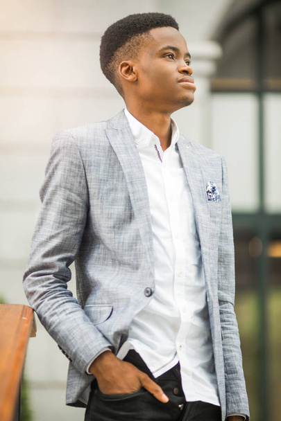 handsome young african man in suit near building - Foto, Imagem